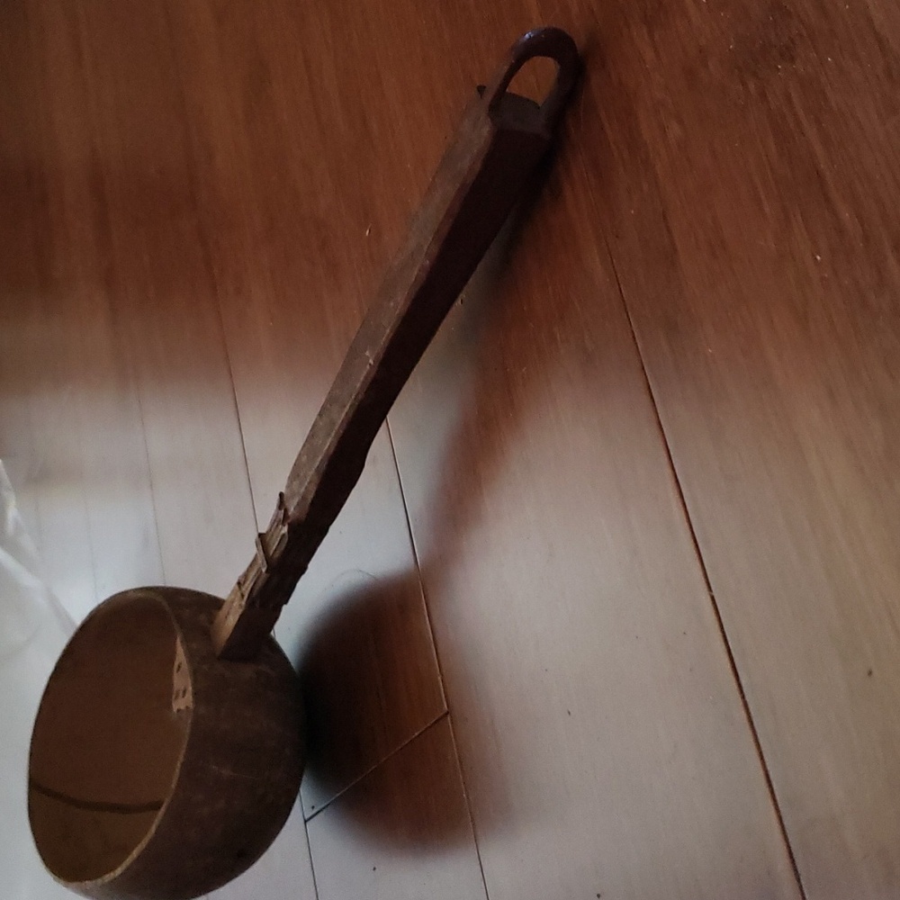 Vintage Handmade Coconut Shell dipper with carved wooden handle